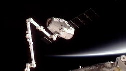 The privately bankrolled Dragon capsule arrived at the International Space Station for a historic docking, captured by astronauts wielding a giant robot arm. 